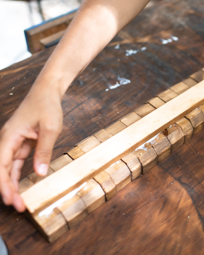 Securing the back of the hanger with a piece of moulding